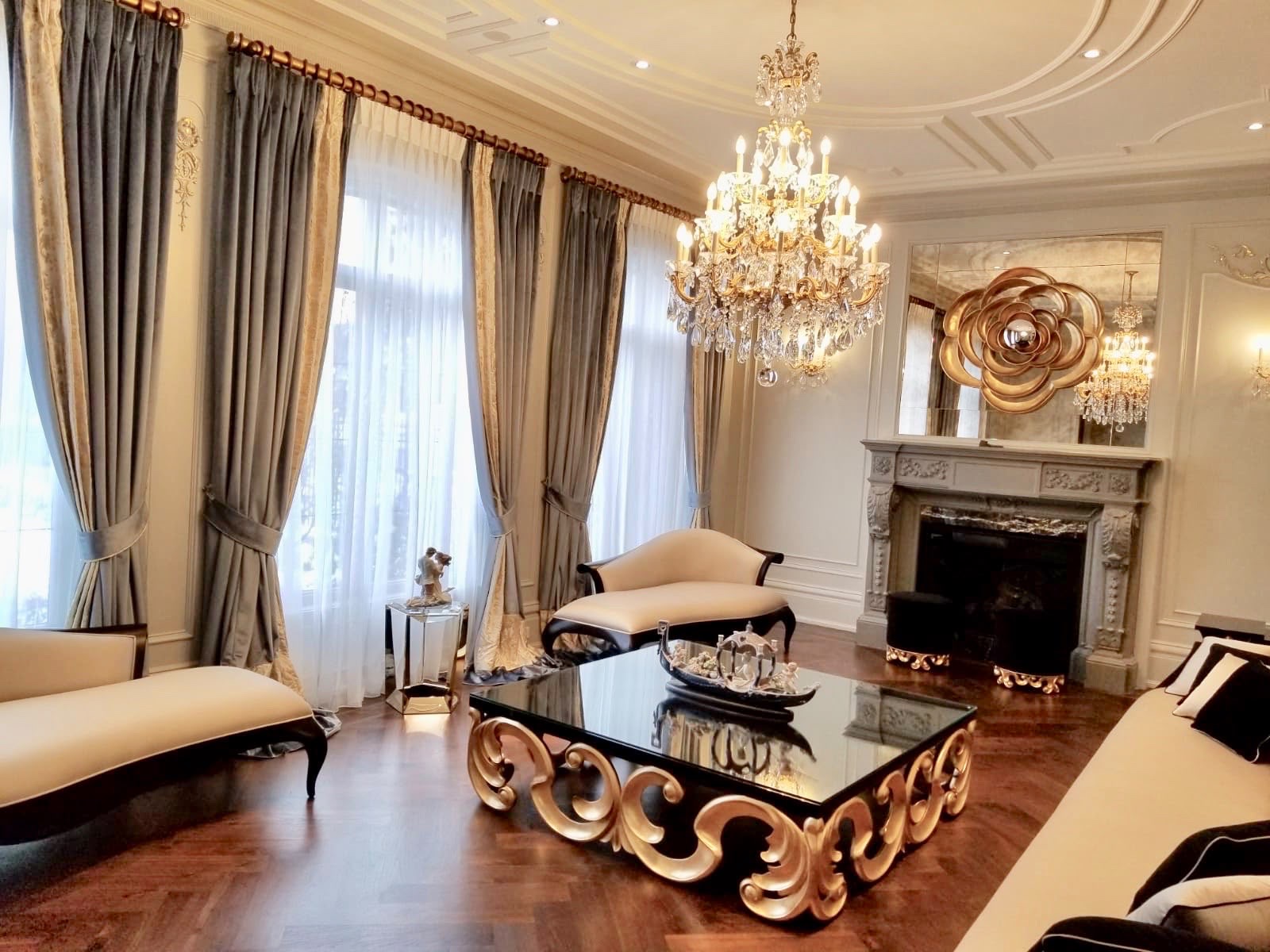 Layered drapery and sheer curtains with tiebacks in a classic living room